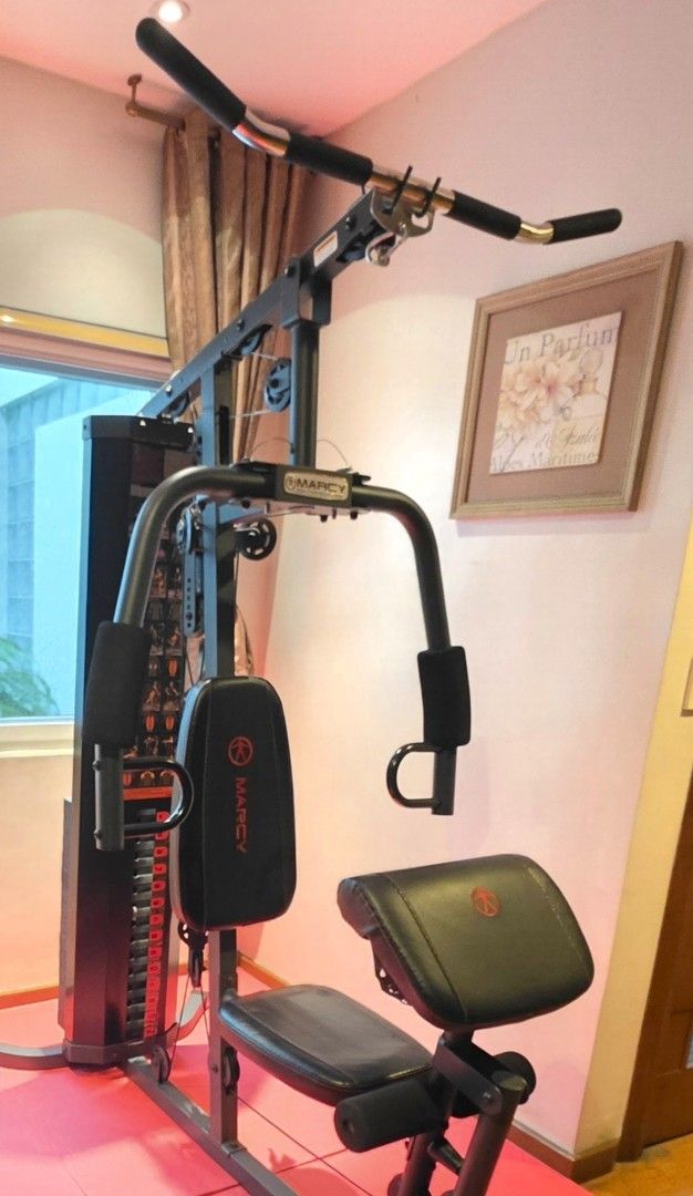 Marcy Home Gym Machine with Weight Stack (Category: Cardio & Fitness Machines) located in Manila. Submitted by jts2026 (Listing ID 1460863666, Image 2). Description: - Marcy Home Gym Machine MWM-990 - Includes weight stack (150llbs) for resistance training - Comes with bench and arm curl attachment - includes a Marcy MKB-11 Utility Work Bench - Ideal for full-body workouts at home - Compact design, fits most spaces - Start your fitness journey to