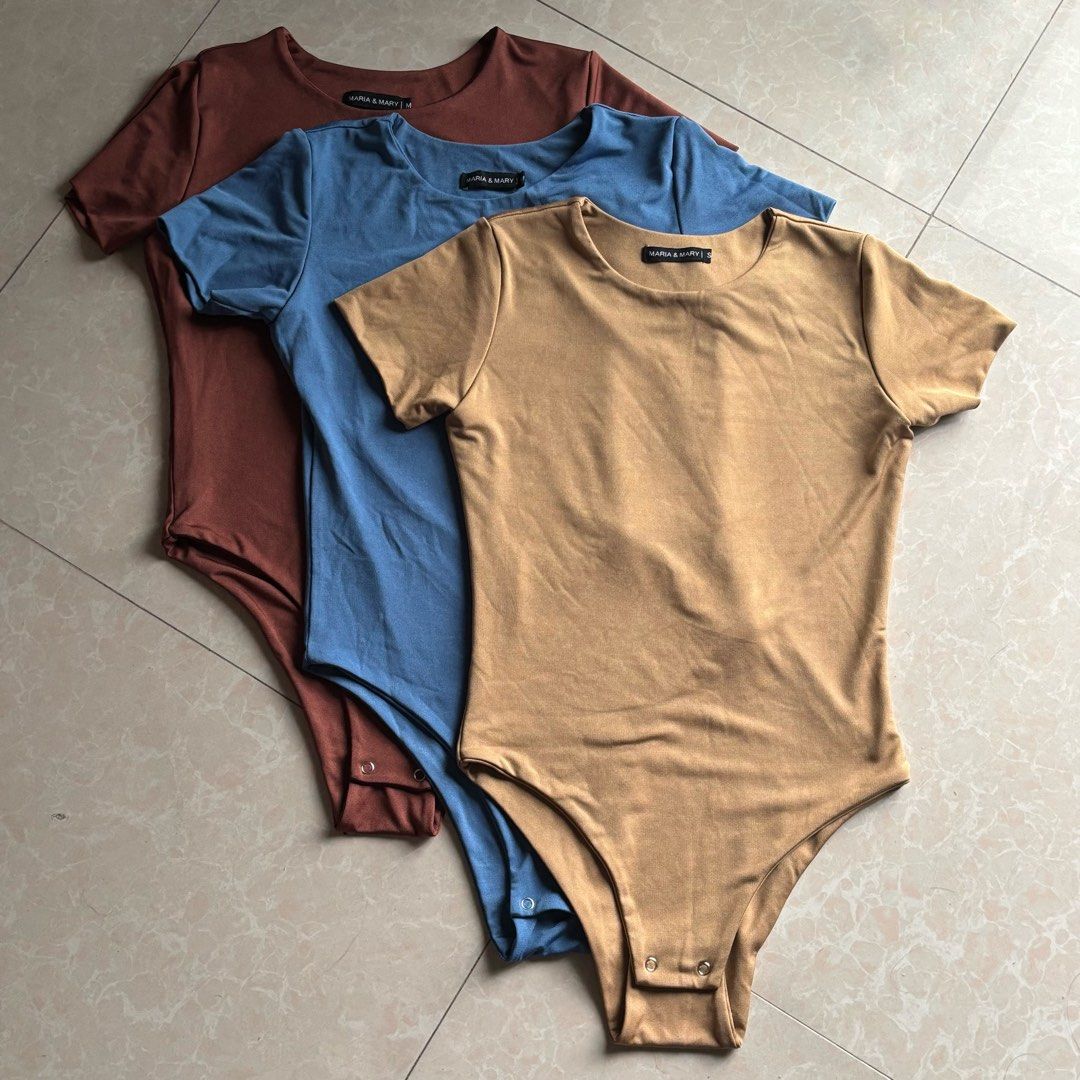 Maria & Mary Short Sleeve Bodysuit (Category: Others Tops) located in Manila. Submitted by glenkm (Listing ID 1460788430, Image 1). Description: - Basic short sleeve bodysuit - Stretchy and comfortable material - Convenient snap closure at the bottom - Available colors: Rust, Blue, Tan, Black Take all for 300.