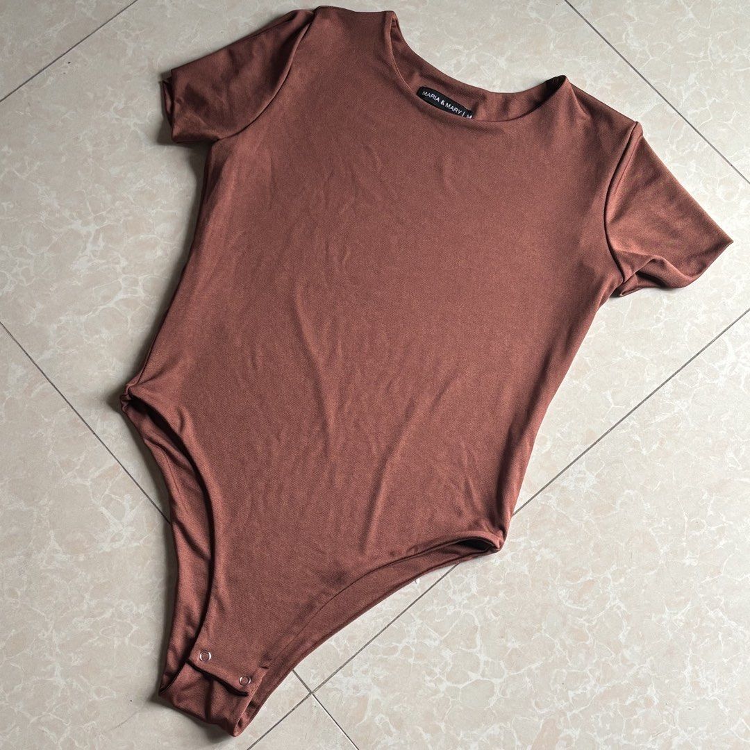 Maria & Mary Short Sleeve Bodysuit (Category: Others Tops) located in Manila. Submitted by glenkm (Listing ID 1460788430, Image 2). Description: - Basic short sleeve bodysuit - Stretchy and comfortable material - Convenient snap closure at the bottom - Available colors: Rust, Blue, Tan, Black Take all for 300.