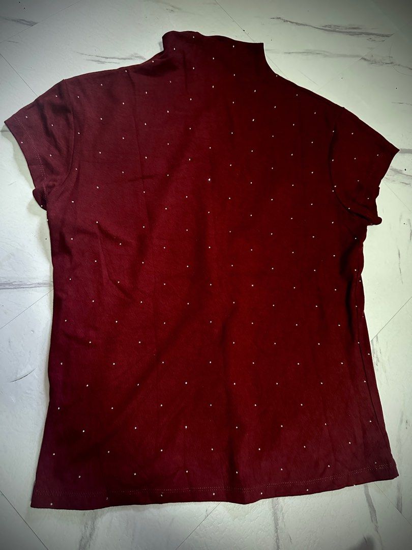 Maroon sparkly semi turtle neck (Category: Blouses) located in Manila. Submitted by tipidfinds888 (Listing ID 1460800437, Image 1). Description: - Maroon short-sleeved t-shirt - Features small white polka dots all over - High neckline design - Comfortable and ideal for everyday casual wear -m to l.