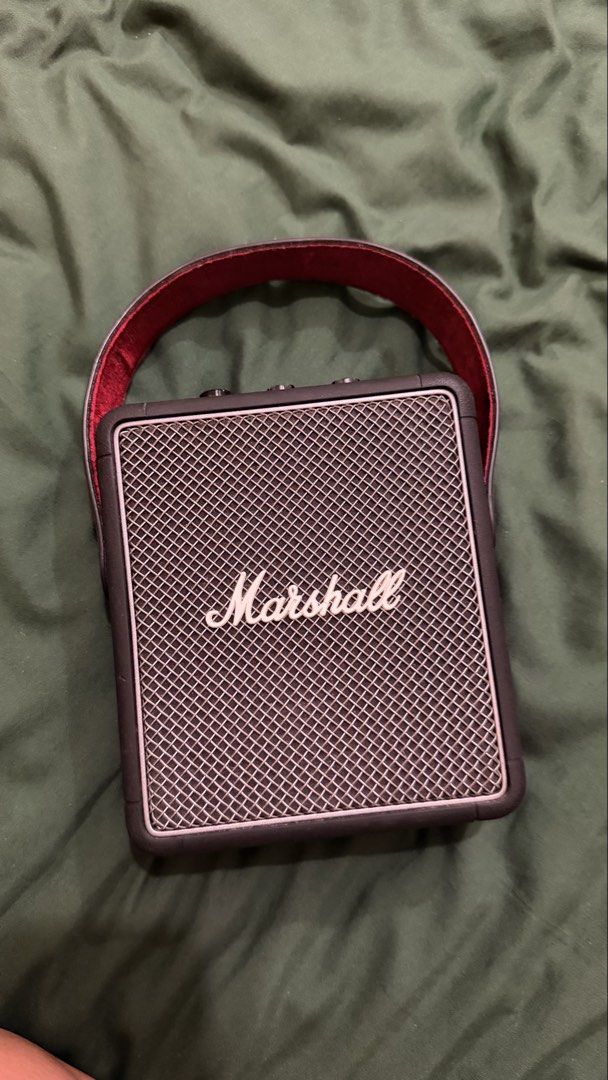 Marshall Stockwell II Portable Bluetooth Speaker (Category: Soundbars, Speakers & Amplifiers) located in Manila. Submitted by raphhern31797 (Listing ID 1460854474, Image 1). Description: Issue - missing top knobs - Marshall Stockwell II portable speaker - Bluetooth connectivity - USB-C power/output port - AUX input - Dedicated volume, bass, and treble controls - Includes red carrying strap - Delivers great sound quality.