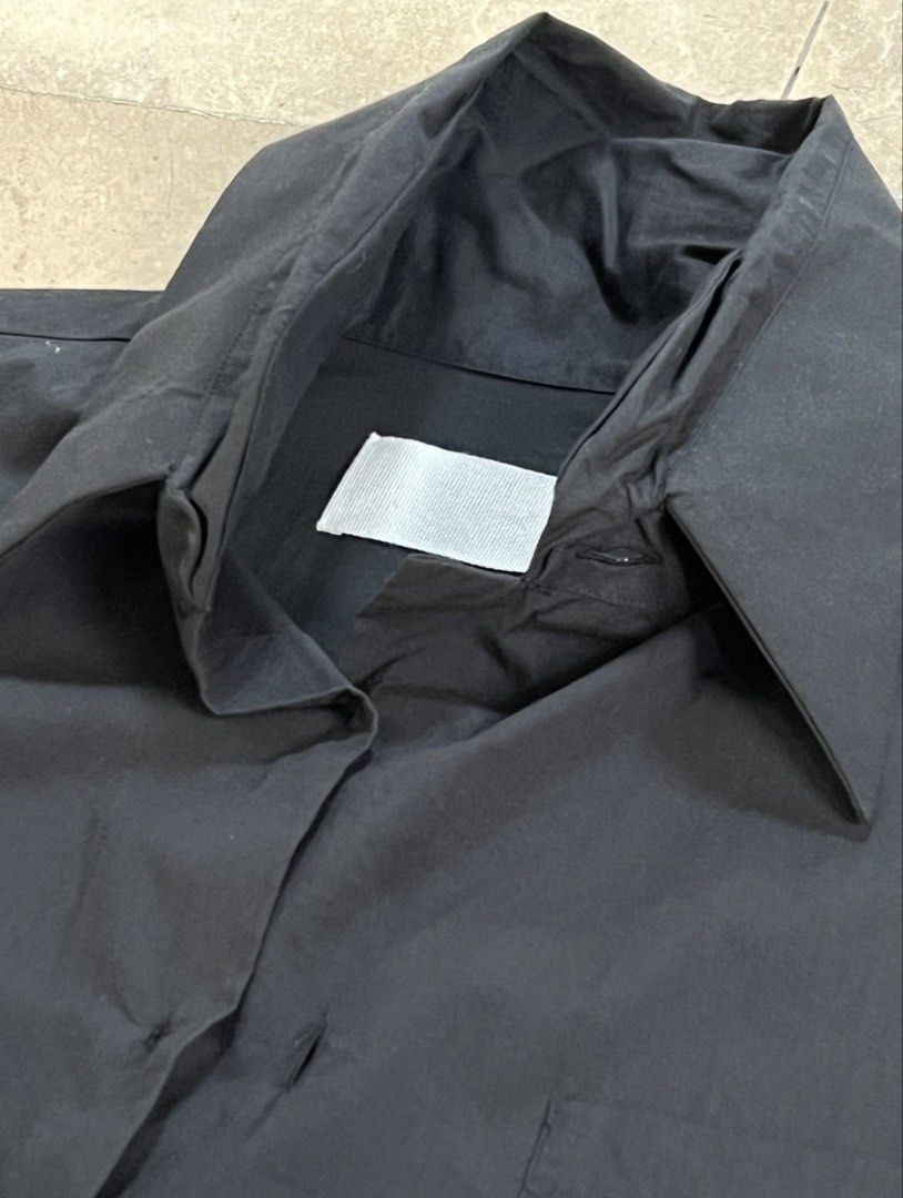 Martin Margiela Spring 2003 deconstructed shirt (Category: Luxury Apparel) located in Quezon City. Submitted by raccoonfur (Listing ID 1460804614, Image 1). Description: Martin Margiela Spring 2003 double collar and double cuff shirt. Interesting meta-construction. Overlocked edges. With absurd buttoning. Exposed cuff fusing for that nonchalant deconstructed feel. Flat measurements: Armpit to armpit 52cm Length 72cm Shoulders 44cm Sleeve inseam 5