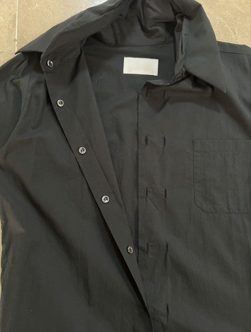 Martin Margiela Spring 2003 deconstructed shirt (Category: Luxury Apparel) located in Quezon City. Submitted by raccoonfur (Listing ID 1460804614, Image 3). Description: Martin Margiela Spring 2003 double collar and double cuff shirt. Interesting meta-construction. Overlocked edges. With absurd buttoning. Exposed cuff fusing for that nonchalant deconstructed feel. Flat measurements: Armpit to armpit 52cm Length 72cm Shoulders 44cm Sleeve inseam 5