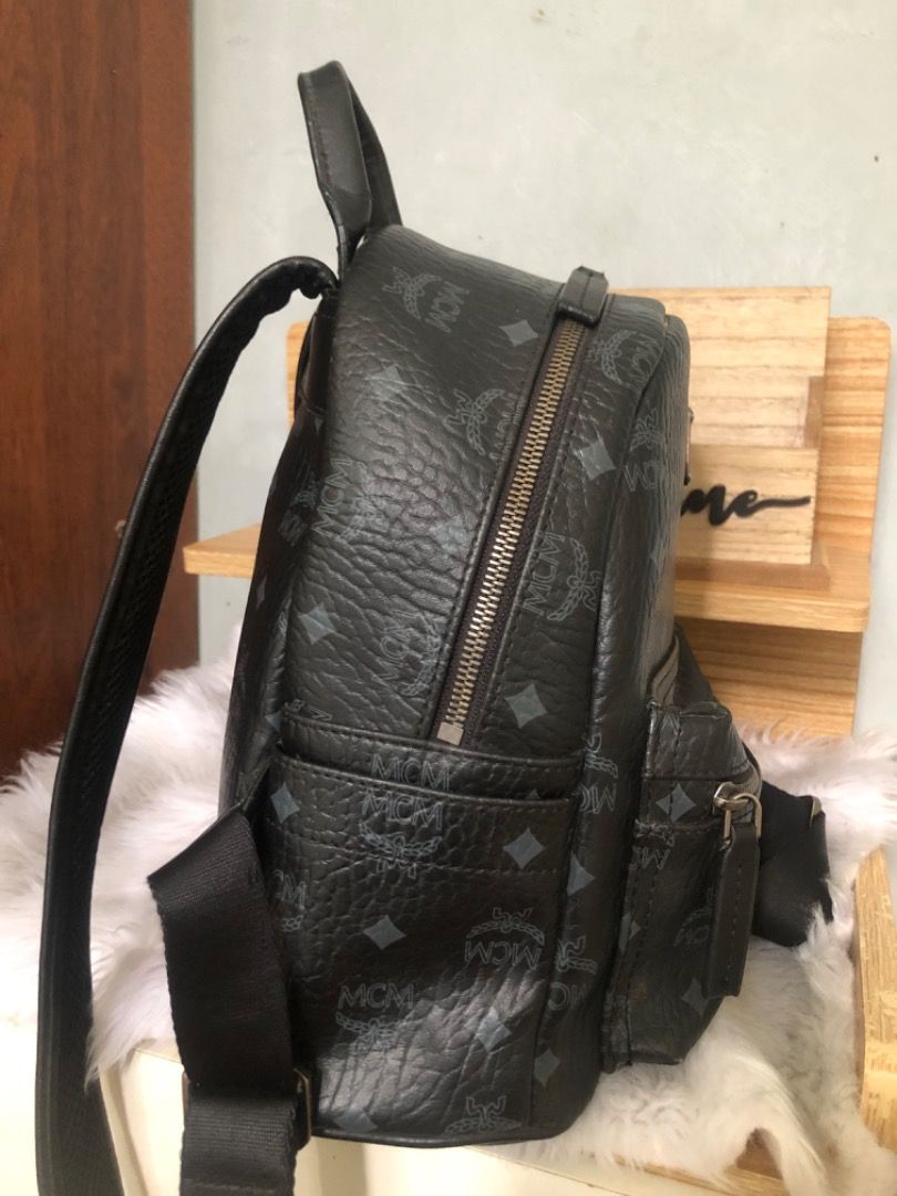 MCM Black Monogram Mini Backpack with Bunny Charm (Category: Backpacks) located in Lucena. Submitted by gracious_chin0436 (Listing ID 1460723035, Image 3). Description: - Adorable bunny charm attached to the front pocket. - Adjustable straps for a comfortable, customized fit. - Ample interior space for all your essentials. - Ideal for everyday use, school, or travel adventures. WITH MINIMAL SIGN OF USED SOME DENTS AND RUBS ON THE BODY KINDLY CHEC