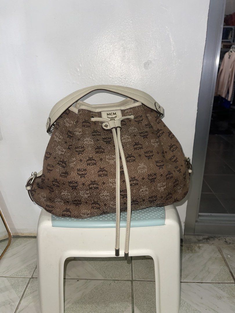 MCM Visetos Jacquard bucket bag (Category: Luxury Bags & Wallets) located in Manila. Submitted by john_robert00 (Listing ID 1460893945, Image 1). Description: MCM Visetos Jacquard bucket bag featuring a brown monogram pattern and cream leather trim. Issue : none Pm sa details.