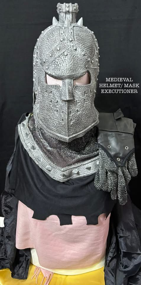 Medieval Executioner Helmet Mask Costume Prop (Category: Babies & Kids Fashion) located in Pasig City. Submitted by genyzk (Listing ID 1460812094, Image 1). Description: - Cool medieval executioner helmet and mask - Great for costumes or cosplay - Includes black cape - Comes with chainmail-style neck piece - Matching glove included - Perfect for Halloween or themed parties - Unique and eye-catching design.