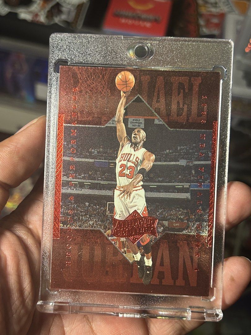Michael Jordan 1998 Upper Deck Card (Category: Raw Singles) located in Iloilo. Submitted by jackpot.treasures (Listing ID 1460918218, Image 1). Description: - Michael Jordan 1998 Upper Deck Card - Features a striking red foil design - Captures Jordan in action - Comes in a protective case - Ideal for basketball fans and collectors.