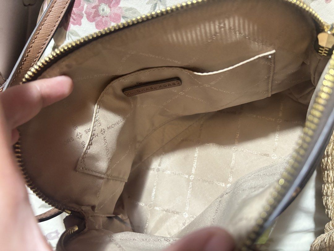 Michael Kors Monogrammed Dome Crossbody Bag (Category: Cross-body Bags) located in Manila. Submitted by ashsarr (Listing ID 1460841263, Image 3). Description: - Authentic Michael Kors crossbody bag in brown. - Features the signature all-over monogram print. - Elegant gold hardware details. - Secure zipper closure. - Interior slip pocket for essentials. - Adjustable strap for comfortable wear. - Ideal for everyday use and versatile styling. 📍VALE