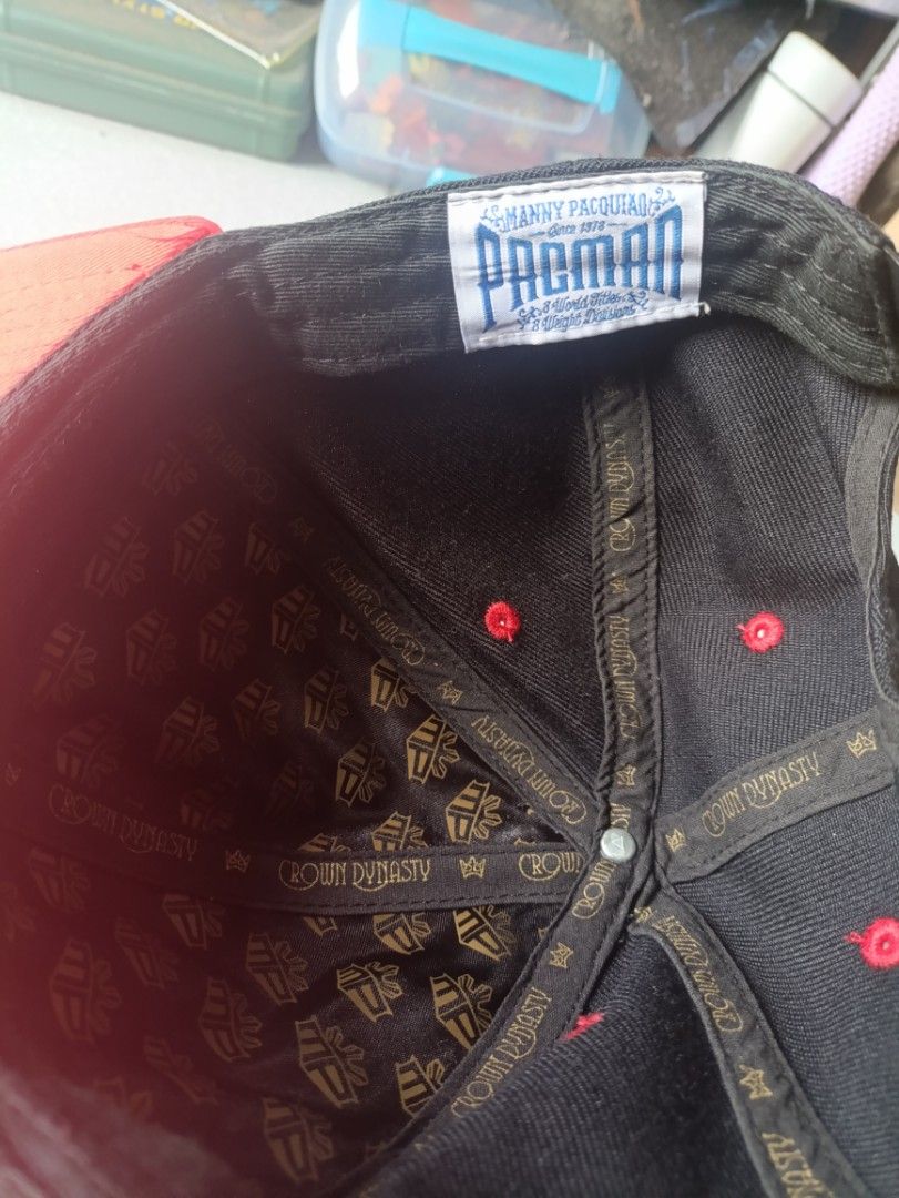 MINDSTYLE MANNY PACQUIAO SNAPBACK CAP (Category: Caps & Hats) located in Quezon City. Submitted by collectandselect (Listing ID 1460752031, Image 2). Description: - Black and red snapback cap - "Manny Pacquiao" and "Pacman" embroidery in gold - "8 World Titles & 8 Weight Divisions" text embroidered - Crown Dynasty branding inside - Adjustable strap at the back Made by MINDSTYLE.