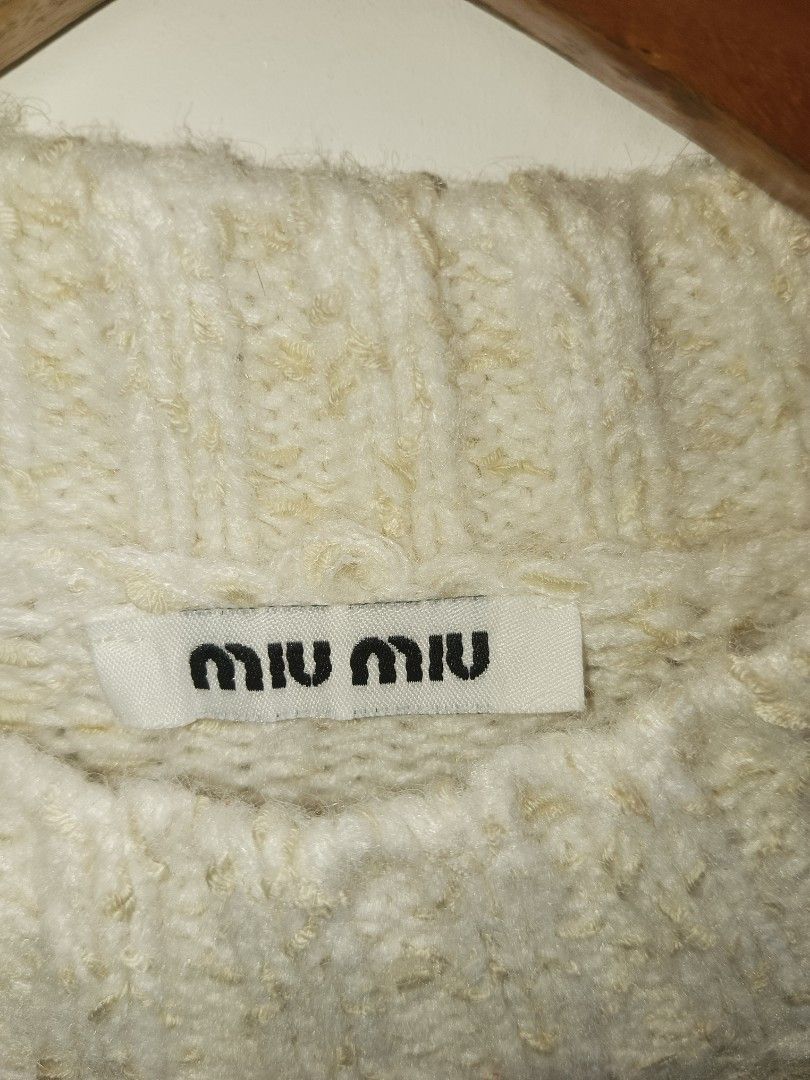 Miu Miu Sequin Knit Sweater (Category: Longsleeves) located in Jolo. Submitted by zah-zah (Listing ID 1460889694, Image 2). Description: - Cream Miu Miu knit sweater - All-over sequin detailing for a glamorous sparkle - Features Miu Miu logo on the front - Material: 100% Wool - Size: S - Origin: Made in China - Versatile: Great for dressing up or down.