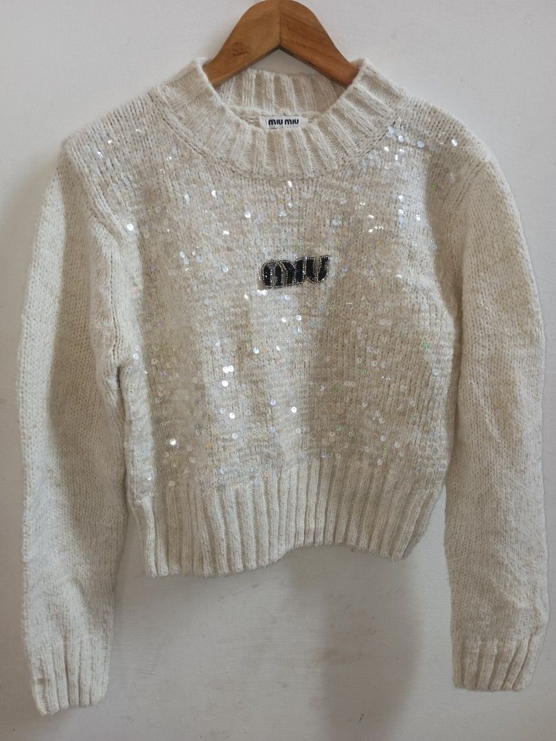 Miu Miu Sequin Knit Sweater (Category: Longsleeves) located in Jolo. Submitted by zah-zah (Listing ID 1460889694, Image 1). Description: - Cream Miu Miu knit sweater - All-over sequin detailing for a glamorous sparkle - Features Miu Miu logo on the front - Material: 100% Wool - Size: S - Origin: Made in China - Versatile: Great for dressing up or down.