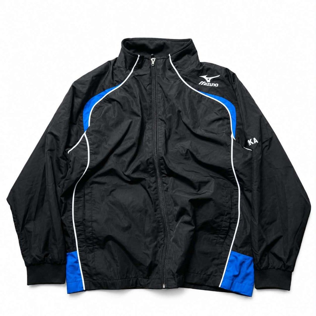 Mizuno Black Blue White Track Jacket (Category: Coats, Jackets and Outerwear) located in Manila. Submitted by chieezz (Listing ID 1460862850, Image 1). Description: - Mizuno track jacket in black - Features blue and white accents - Full zip closure for easy wear - Ribbed cuffs and hem for a snug fit - 'KA' embroidered on the right sleeve - Versatile for sports or casual outfits.