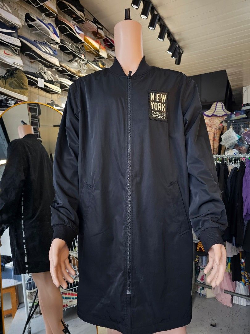 MLB New York Yankees long bomber jacket (Category: Coats, Jackets and Outerwear) located in Baguio. Submitted by kayeonlineshop (Listing ID 1460796889, Image 1). Description: -black MLB New York Yankees long bomber jacket featuring a distinctive chest patch -measurements included in the photos.