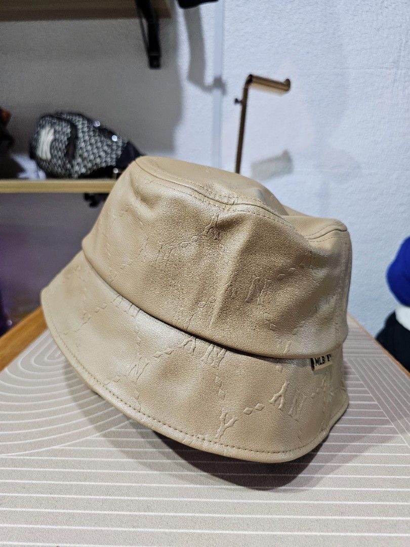 MLB New York Yankees monogram bucket hat (Category: Caps & Hats) located in Baguio. Submitted by kayeonlineshop (Listing ID 1460741506, Image 3). Description: -MLB New York Yankees monogram bucket hat in a tan faux leather finish with a metallic NY logo pin on the front. -unisex.