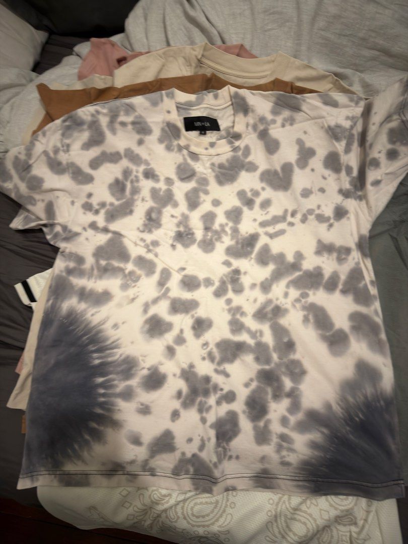 MNLA Tie-Dye T-Shirt (Category: Tshirts & Polo Shirts ) located in Santa Maria. Submitted by genebryle27 (Listing ID 1460880184, Image 1). Description: - Authentic UNIF LA tie-dye t-shirt - Unique grey and white pattern with dark grey sleeve accents - Estimated size M (please check measurements if available) - Ideal for everyday casual wear - Versatile styling with jeans or shorts LALAMOVE ,JNT DELIVERY.