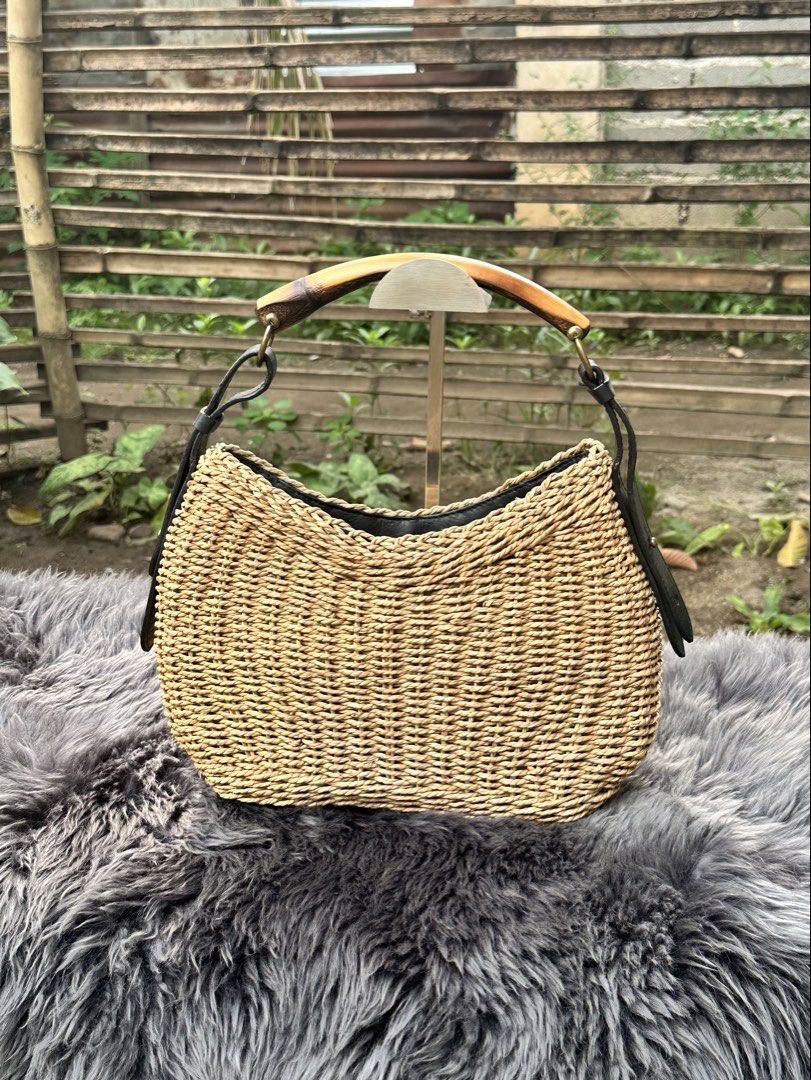Mombasa Bamboo handle Knitted Bag. (Category: Shoulder Bags) located in Cagayan de Oro. Submitted by kjcartier26 (Listing ID 1460863453, Image 1). Description: - Made in Italy. 😱 - Flawless, In good condition - Clean inside/Outside, Corners, Zippers. - Has minimal Powderize Bottom part, But still doesn’t affect the Precious bag. - Zipper Needs Cleaning..