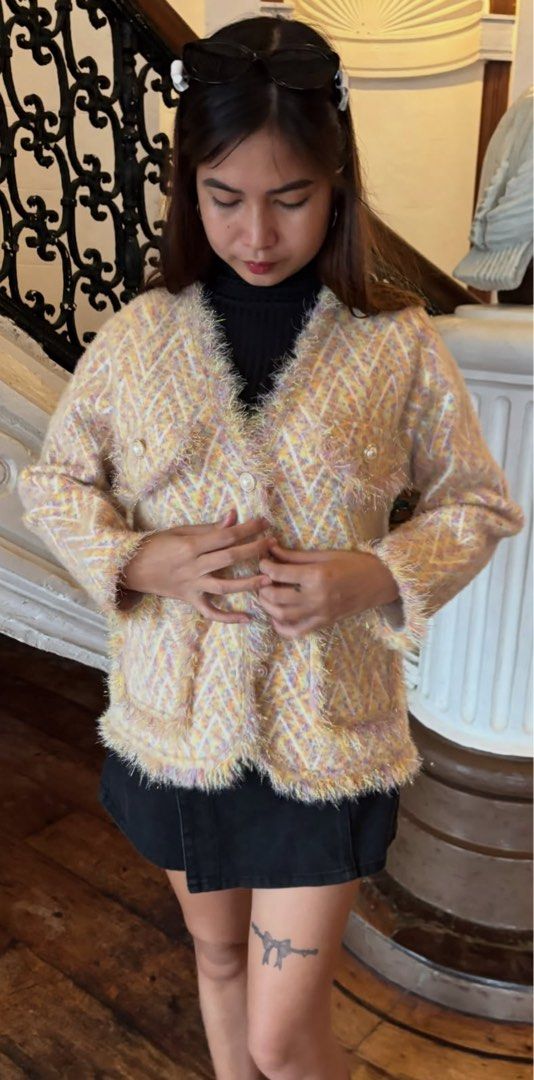 Moschino Couture! Knit Cardigan (Category: Coats, Jackets and Outerwear) located in Alcala. Submitted by dela.sole (Listing ID 1460724058, Image 3). Description: - Moschino Couture knit cardigan - Fuzzy texture with a chevron pattern - Pastel colors: yellow, pink, and purple - Two front pockets - Pearl button closure - Super cozy and chic - Great for layering.