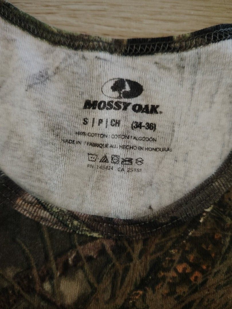 Mossy Oak Camouflage Tank Top - Size S (Category: Sleeveless) located in Nasipit. Submitted by edwingonzales498-69377 (Listing ID 1460850559, Image 3). Description: - Mossy Oak camouflage tank top - Size: Small - Material: 100% Cotton - Feature: Stretchable fabric - Ideal for: Outdoor activities, casual wear.