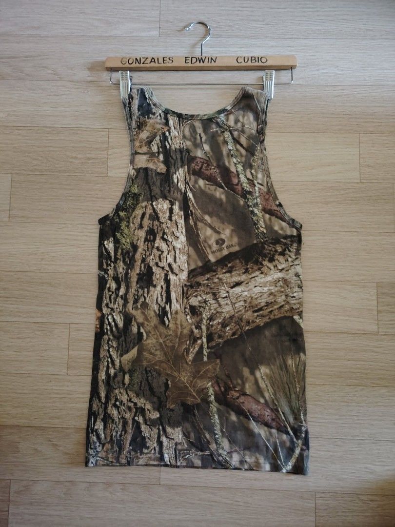 Mossy Oak Camouflage Tank Top - Size S (Category: Sleeveless) located in Nasipit. Submitted by edwingonzales498-69377 (Listing ID 1460850559, Image 2). Description: - Mossy Oak camouflage tank top - Size: Small - Material: 100% Cotton - Feature: Stretchable fabric - Ideal for: Outdoor activities, casual wear.