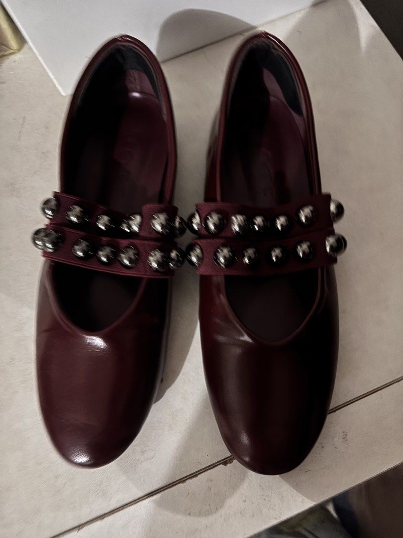 MOTF Burgundy Studded Ballet Flats (Category: Flats & Sandals) located in Manila. Submitted by ssgvillal34630 (Listing ID 1460736831, Image 2). Description: - Burgundy ballet flats from MOTF - Features a double strap with silver studs - Comfortable slip-on style - Versatile for dressing up or down.