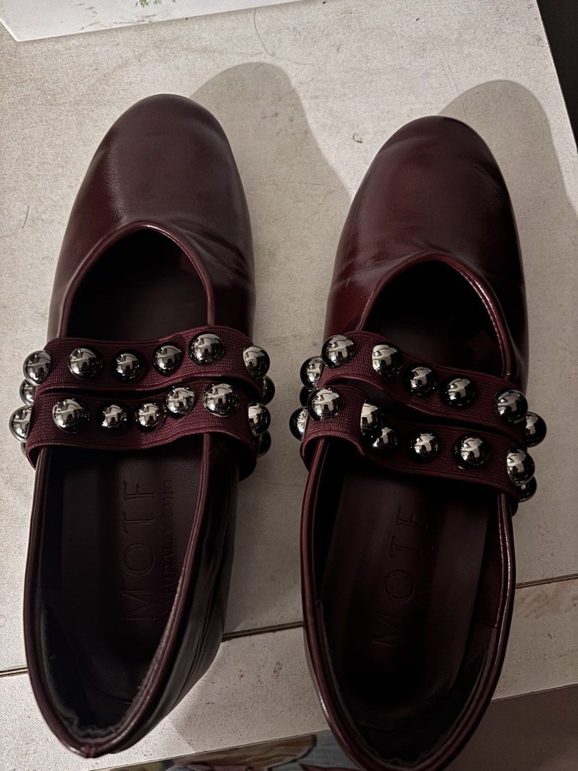 MOTF Burgundy Studded Ballet Flats (Category: Flats & Sandals) located in Manila. Submitted by ssgvillal34630 (Listing ID 1460736831, Image 1). Description: - Burgundy ballet flats from MOTF - Features a double strap with silver studs - Comfortable slip-on style - Versatile for dressing up or down.