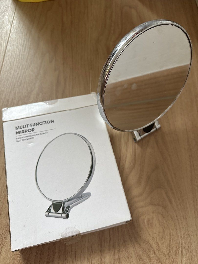 Multi-Function Mirror - Tabletop or Wall Mount (Category: Mirrors) located in Singapore. Submitted by hengonghu4t (Listing ID 1460748427, Image 2). Description: - Multi-function mirror, dual side mirror - Can be used as a tabletop mirror or hung on the wall - Features a sleek chrome finish - Round shape - Versatile for any room - Ideal for makeup application or as a decorative accent.