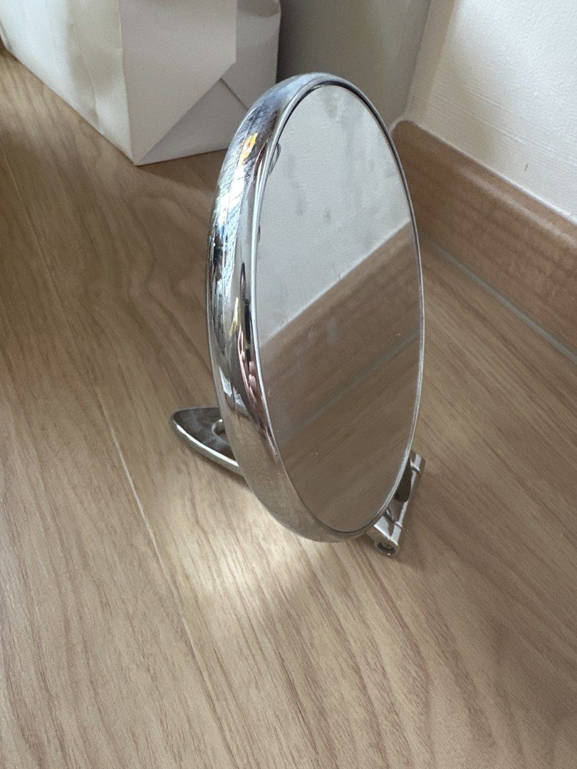Multi-Function Mirror - Tabletop or Wall Mount (Category: Mirrors) located in Singapore. Submitted by hengonghu4t (Listing ID 1460748427, Image 1). Description: - Multi-function mirror, dual side mirror - Can be used as a tabletop mirror or hung on the wall - Features a sleek chrome finish - Round shape - Versatile for any room - Ideal for makeup application or as a decorative accent.