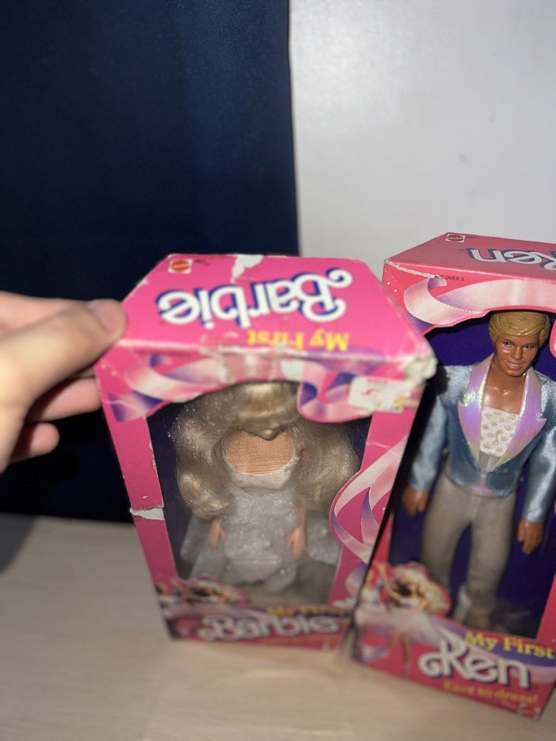 My First Barbie and Ken Dolls (Category: Kids Toys) located in Manila. Submitted by asa68984 (Listing ID 1460875151, Image 2). Description: - My First Barbie and Ken Dolls - Easy to Dress models - Barbie in a white gown - Ken in a sparkly blue jacket and white pants - Boxes show some wear and tear - Great for collectors or play.