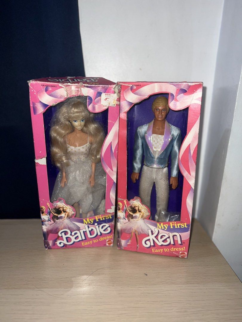 My First Barbie and Ken Dolls (Category: Kids Toys) located in Manila. Submitted by asa68984 (Listing ID 1460875151, Image 1). Description: - My First Barbie and Ken Dolls - Easy to Dress models - Barbie in a white gown - Ken in a sparkly blue jacket and white pants - Boxes show some wear and tear - Great for collectors or play.