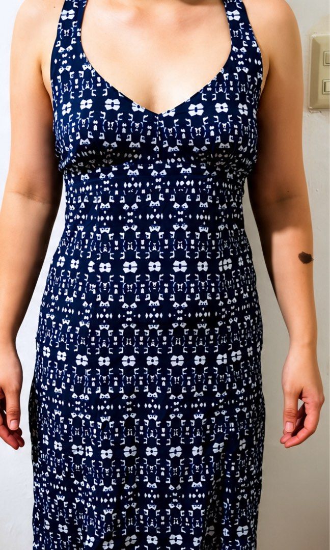 Navy Blue White Patterned Halter Neck Dress (Category: Dresses) located in Manila. Submitted by charlotte.mae (Listing ID 1460793405, Image 1). Description: - Navy blue midi dress - White abstract pattern - Halter neck with V-neckline - Stretchy and comfortable material - Midi length - Ideal for casual outings or beach days - Easy to wear and style.