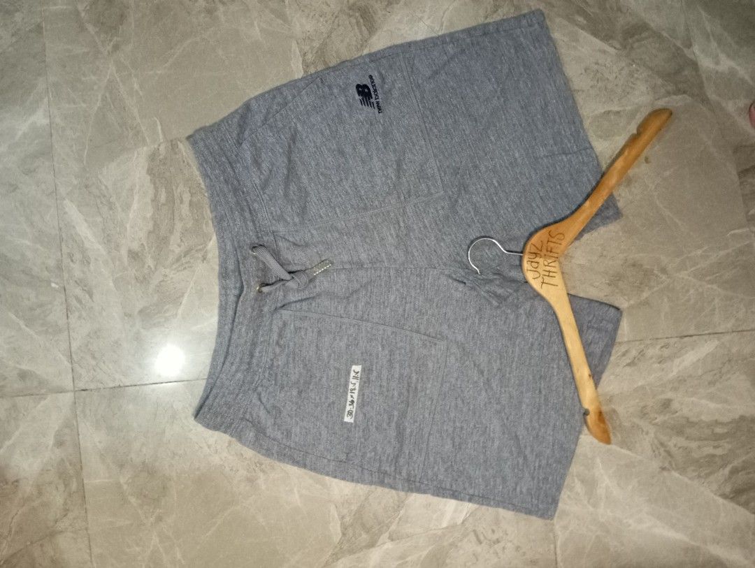 New Balance Grey Sweat Shorts (Category: Shorts) located in Quezon City. Submitted by ThriftsPaMore (Listing ID 1460763668, Image 2). Description: - Brand: New Balance - Color: Grey - Type: Sweat Shorts - Size: XL 30-36 *18.5, Inseam 11.5 - Features: Elastic waistband with drawstring, front pockets - Ideal for: Lounging, casual wear - Material: Comfortable fabric -Excellent Condition Location Quezon City J&T Courier Gcash Payment .