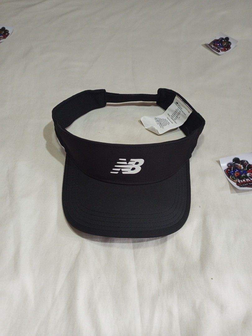 New Balance Visor Cap Hat (Category: Caps & Hats) located in General Santos City (Dadiangas). Submitted by nonoks1234 (Listing ID 1460920369, Image 2). Description: - Grey and black New Balance visors - Ideal for sports or sunny weather - Adjustable strap at the back for a comfortable fit - Features the New Balance logo on the front - Available for purchase as a pair or separately.