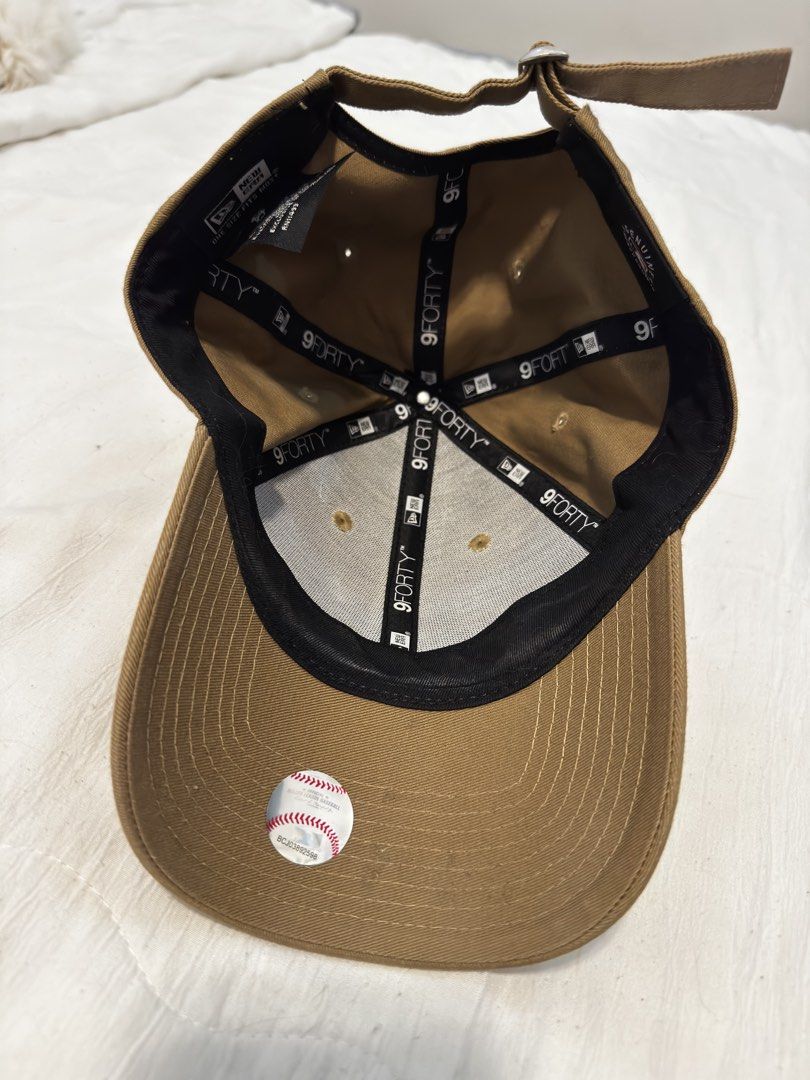 New Era LA Dodgers Baseball Cap (Category: Caps & Hats) located in Marikina City. Submitted by daintyaesthetics (Listing ID 1460811988, Image 3). Description: - Brown New Era cap - Features embroidered LA Dodgers logo in blue on the front - New Era logo on the side - Adjustable strap at the back - Ideal for everyday wear.
