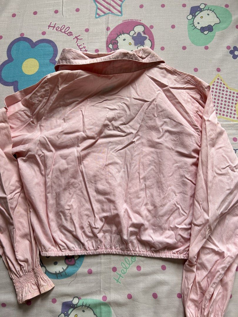 NEXT Pink Cropped Button-Up Shirt Size S (Category: Shirts) located in Antipolo. Submitted by sophueya (Listing ID 1460746653, Image 2). Description: - Pink cropped shirt from NEXT - Button-up front with a collar - Elasticated hem and cuffs - Long sleeves - Easy to style with jeans or shorts for a casual look.