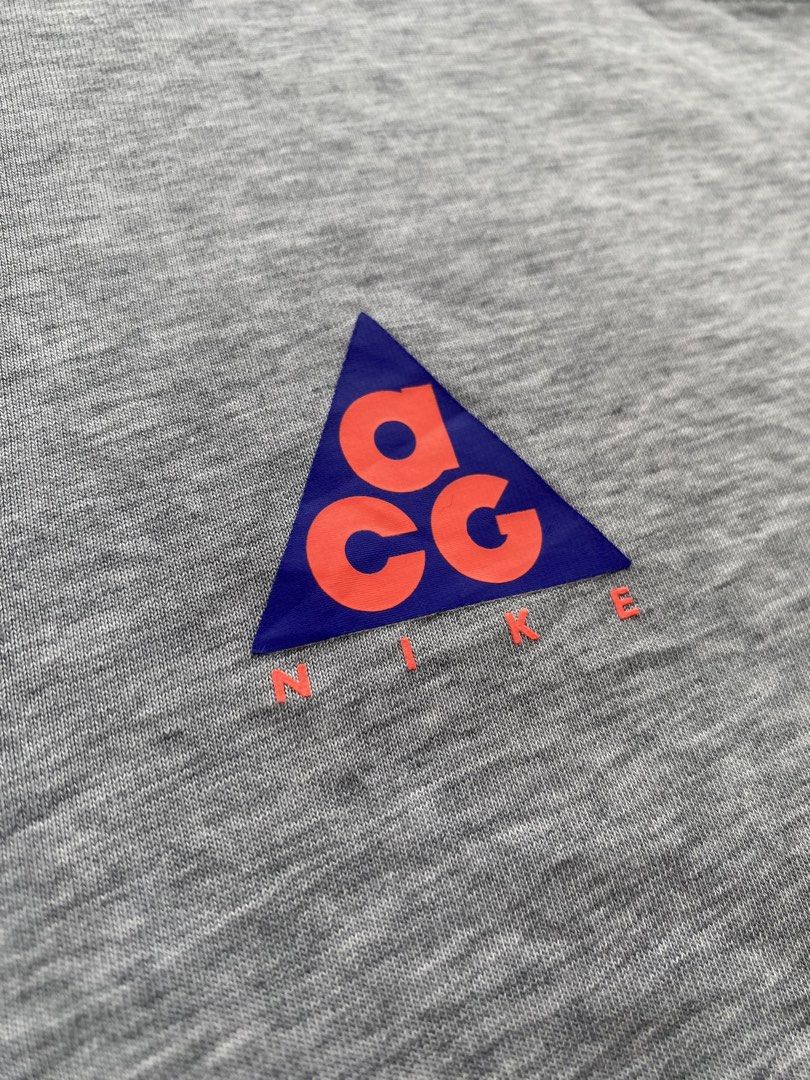 Nike ACG “Go Climb A Volcano” Tee (s19) (Category: Activewear) located in Taguig. Submitted by offther4ck (Listing ID 1460814501, Image 3). Description: - Issue: Faded Neck tag and Wide neckline - Size Large on tag - Dri-Fit - Width: 20 inches - Length: 27 inches.