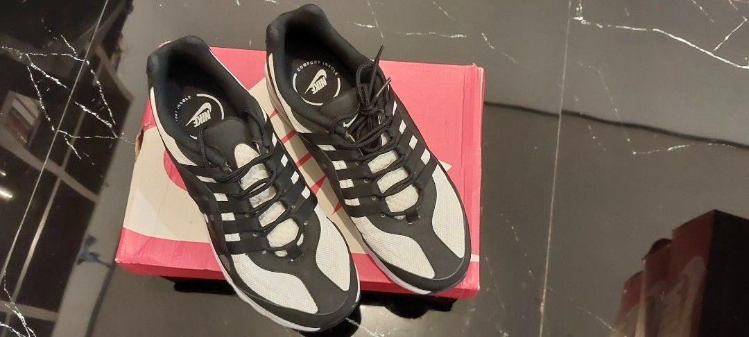 Nike Air Max US size 9.5 men (Category: Sneakers) located in Quezon City. Submitted by ShoesManila (Listing ID 1460904432, Image 3). Description: - Nike Air Max - Classic black and white colorway - Breathable mesh upper with synthetic overlays - Features a visible Air unit in the heel for comfort - Comes with the original box - Perfect for running or everyday casual wear.