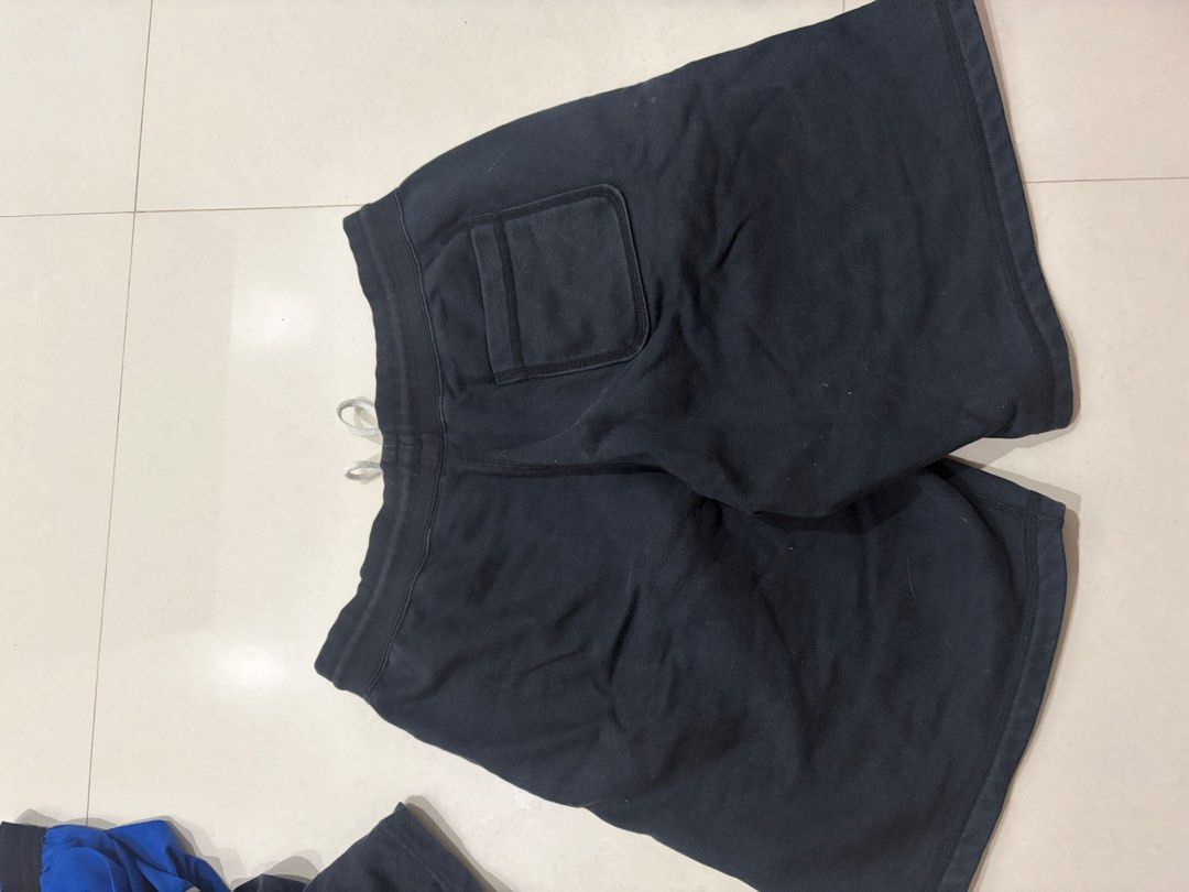 Nike Black Drawstring Shorts (Category: Shorts) located in Marilao. Submitted by astroman.22 (Listing ID 1460887901, Image 2). Description: - Black Nike shorts - Comfortable and simple design - Drawstring elastic waistband with tie - Side pockets for convenience - Iconic Nike logo on the left leg - Ideal for lounging or casual wear.