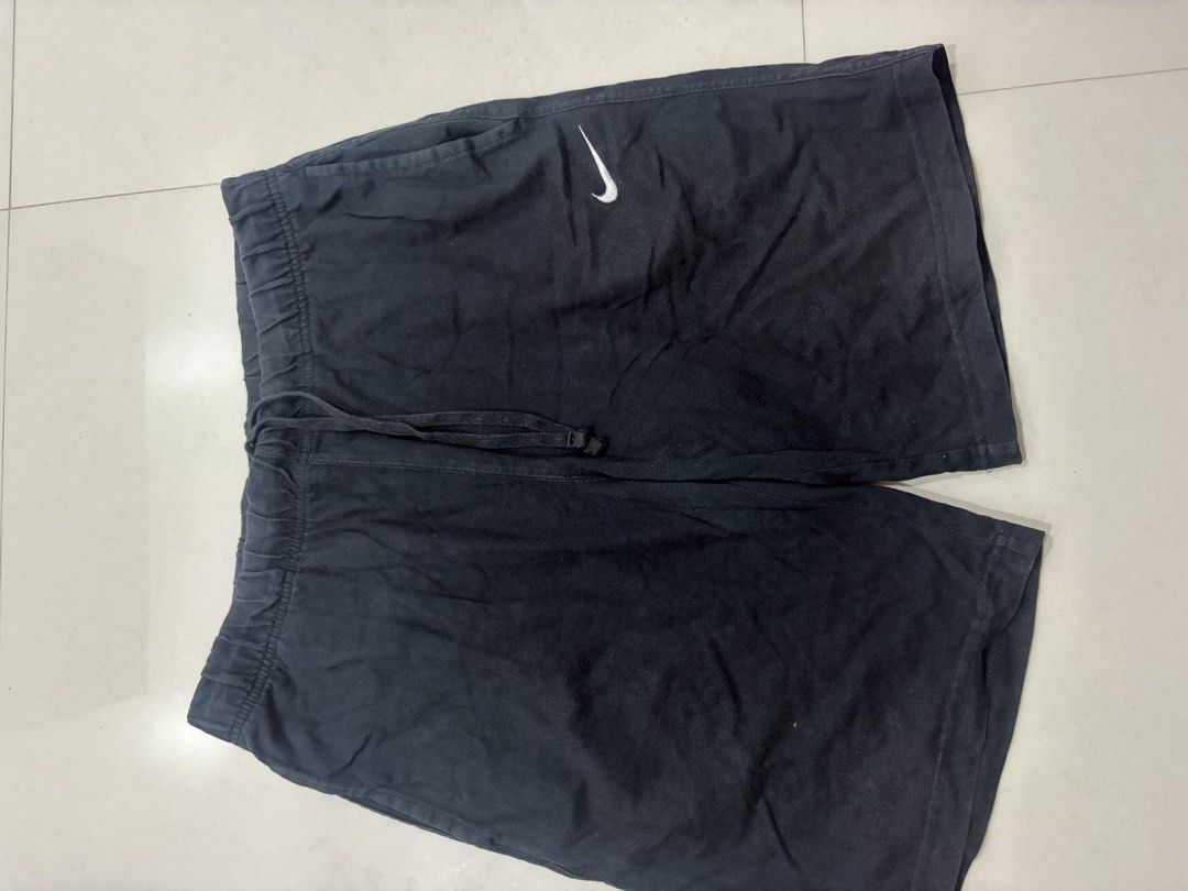 Nike Black Drawstring Shorts (Category: Shorts) located in Marilao. Submitted by astroman.22 (Listing ID 1460887901, Image 1). Description: - Black Nike shorts - Comfortable and simple design - Drawstring elastic waistband with tie - Side pockets for convenience - Iconic Nike logo on the left leg - Ideal for lounging or casual wear.