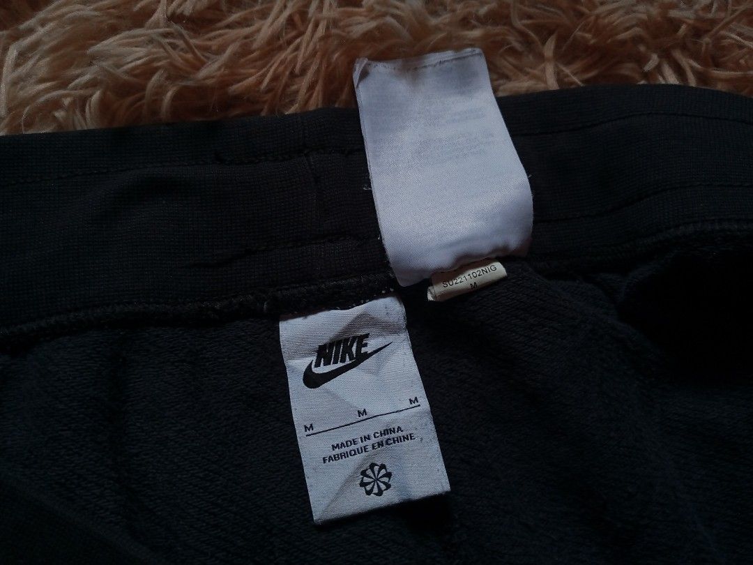 Nike Black Sweat Shorts with Large Logo (Category: Shorts) located in Boston. Submitted by johnpaulvi30029 (Listing ID 1460811898, Image 3). Description: - Black Nike sweat shorts - Large white Nike logo on left leg - Drawstring waist for adjustable fit - Two side pockets - Made in China - Size M.