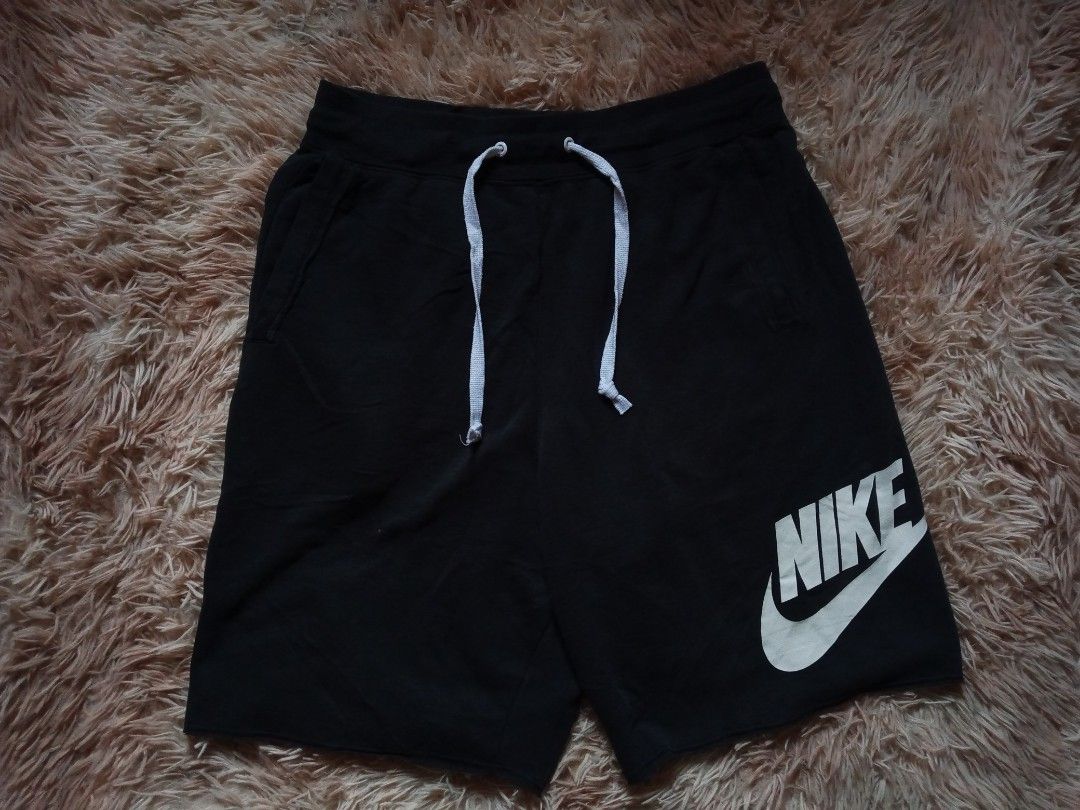 Nike Black Sweat Shorts with Large Logo (Category: Shorts) located in Boston. Submitted by johnpaulvi30029 (Listing ID 1460811898, Image 2). Description: - Black Nike sweat shorts - Large white Nike logo on left leg - Drawstring waist for adjustable fit - Two side pockets - Made in China - Size M.