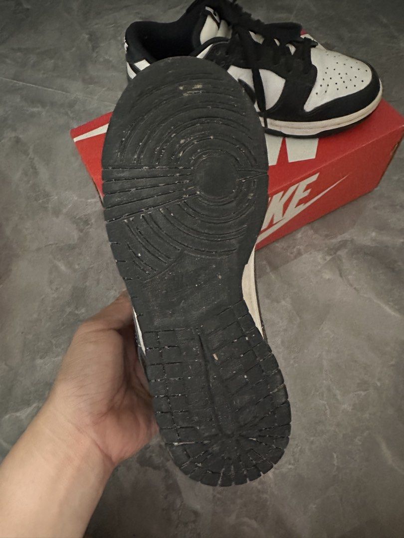 Nike Dunk Low Black White Panda (Category: Sneakers) located in Paombong. Submitted by essdeclutter (Listing ID 1460723250, Image 3). Description: - Classic black and white Nike Dunks - Iconic 'Panda' colorway - Perfect for everyday wear - Shows some signs of use on soles and uppers - Comes with original box.