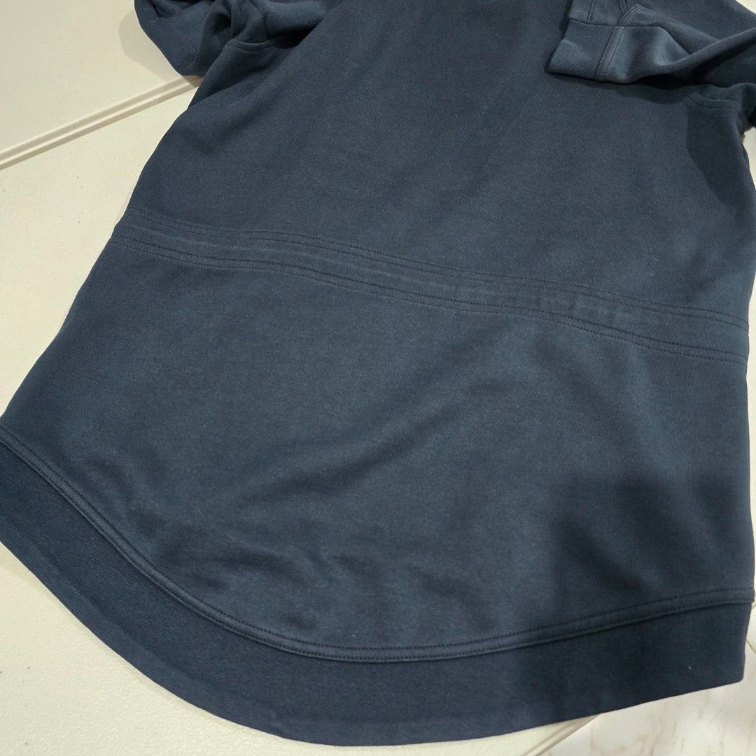 Nike Navy Blue Asymmetrical Zip Hoodie (Category: Coats, Jackets and Outerwear) located in Manila. Submitted by nnthrift_ (Listing ID 1460892984, Image 2). Description: - Navy blue zip-up hoodie - Asymmetrical zip closure - Two front pockets - Curved hemline - Comfortable and casual design - Ideal for layering - Measurements: Width 19.5 inches, Length 25.5 inches.