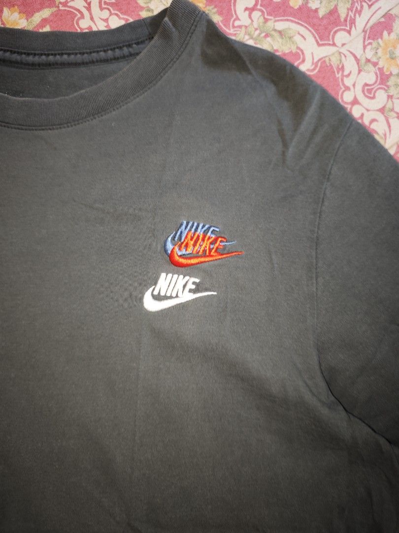 Nike T-shirt with multiple logos (Category: Tshirts & Polo Shirts ) located in Calauag. Submitted by erv_1n (Listing ID 1460718069, Image 3). Description: 8/10 color rate 21x28 Issue fade coded tag.