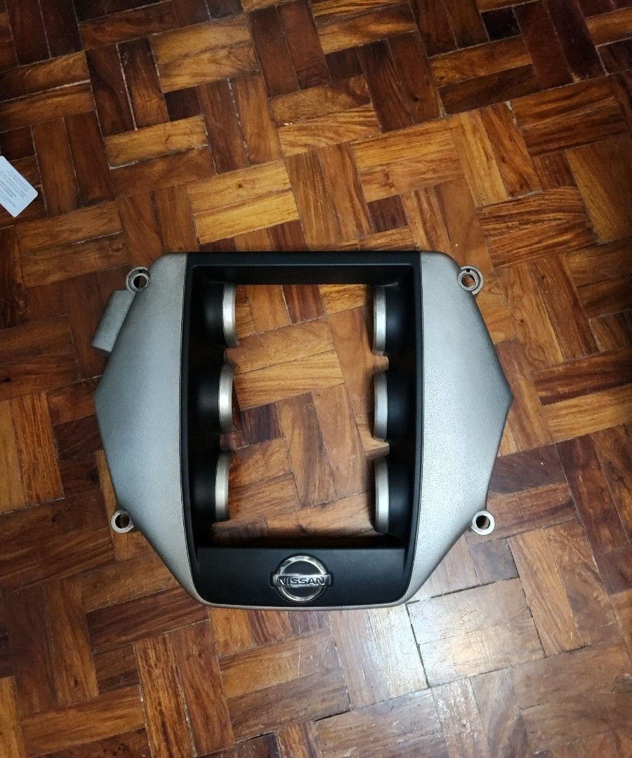 Nissan GTR R35 engine cover (Category: Other Automotive Parts and Accessories) located in Quezon City. Submitted by wvfmerchandise (Listing ID 1460910398, Image 1). Description: - Genuine Nissan GTR 35 engine cover (upper part with logo) - Intake manifold gasket (lower part with foam padding) - Both pieces included - Removed from a running vehicle - Ready for installation.