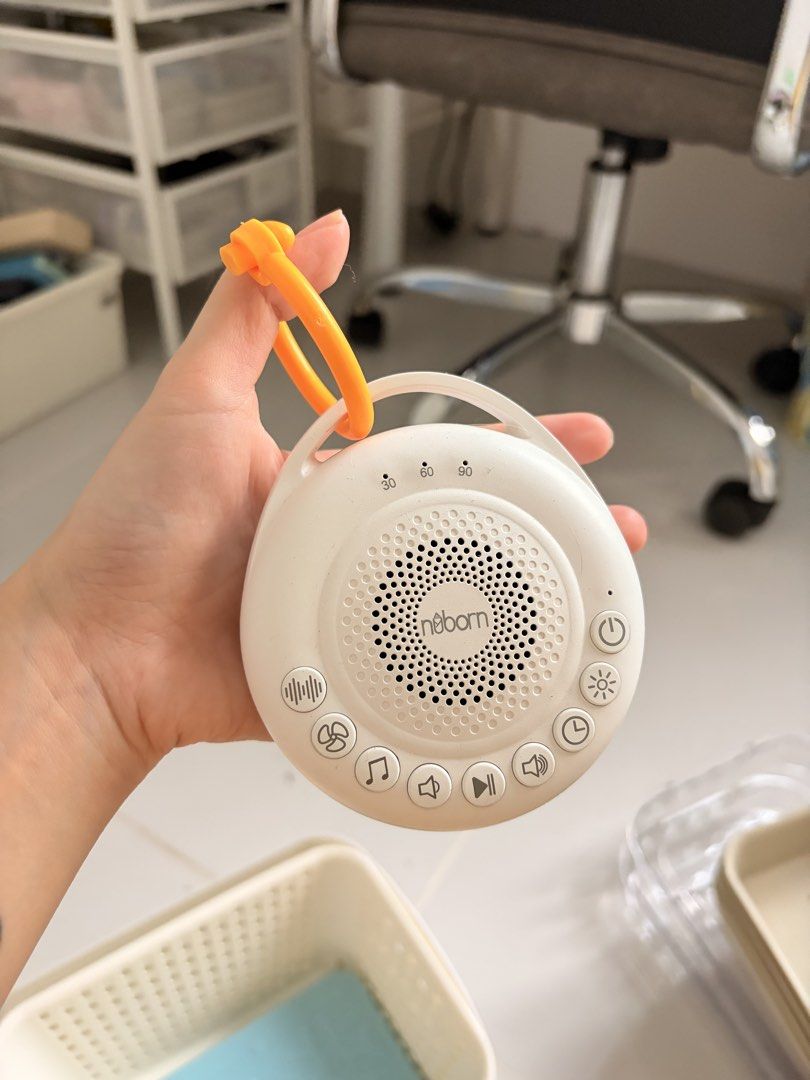 Nuborn Snuzz White Portable Sound Machine with Timer (Category: Other Home Appliances) located in Manila. Submitted by aubreyours07 (Listing ID 1460876720, Image 1). Description: - White Nuborn portable sound machine - Multiple sound options - Volume control - Timer settings: 30, 60, 90 minutes - Built-in light function - Comes with an orange clip for easy hanging - Ideal for baby's sleep or travel companion.