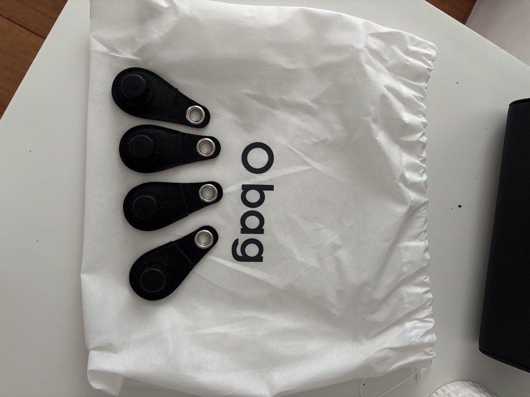 O bag Black Tote Bag with Handles and Inserts (Category: Tote Bags) located in Manila. Submitted by khloesmom (Listing ID 1460723898, Image 3). Description: - Made in Italy -Genuine black O bag tote - Features shiny black handles - Comes with four interchangeable black inserts - Includes a drawstring dust bag for protection - Ideal for everyday use with its simple and chic design.