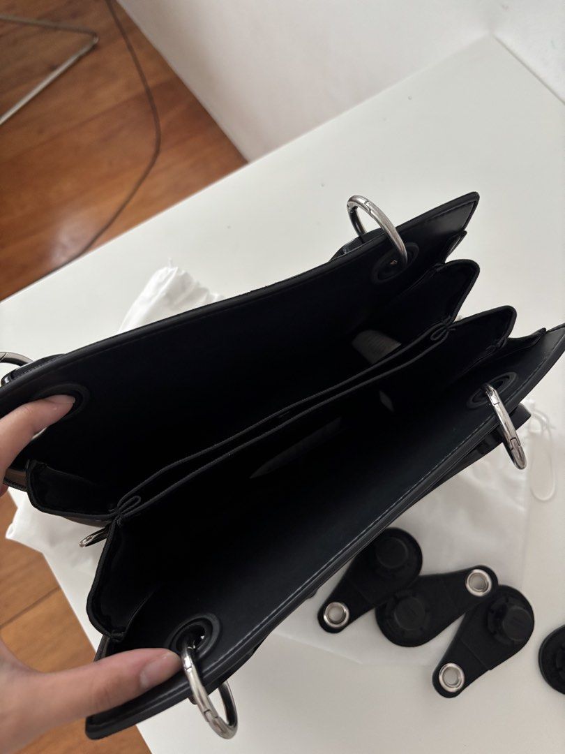 O bag Black Tote Bag with Handles and Inserts (Category: Tote Bags) located in Manila. Submitted by khloesmom (Listing ID 1460723898, Image 2). Description: - Made in Italy -Genuine black O bag tote - Features shiny black handles - Comes with four interchangeable black inserts - Includes a drawstring dust bag for protection - Ideal for everyday use with its simple and chic design.