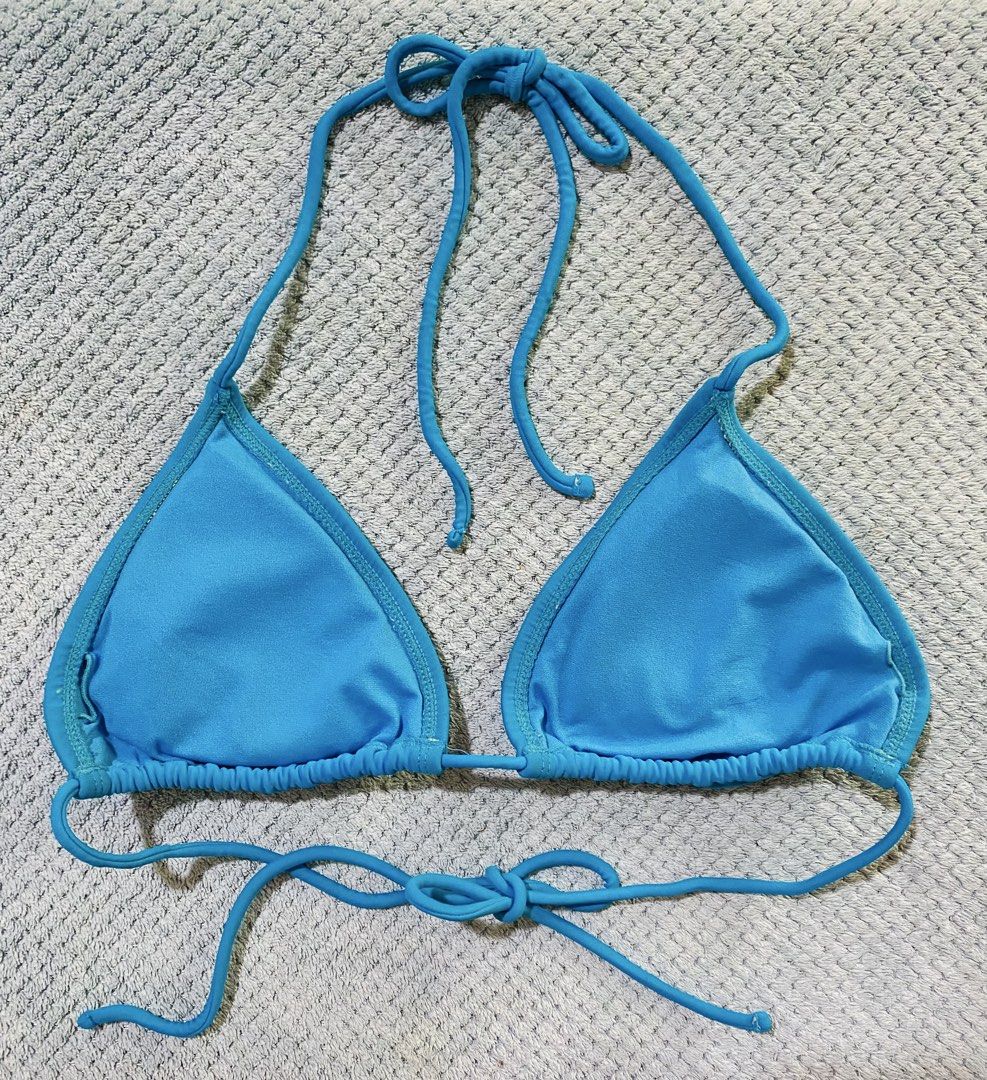 Ocean Pacific Blue String Bikini Top (Category: Bikinis & Swimsuits) located in Bacolod City. Submitted by bravefire_3fe6dd (Listing ID 1460745547, Image 2). Description: - Blue triangle bikini top - Ties at neck and back for adjustable fit - Ocean Pacific logo embroidered on right cup - Perfect for beach or pool days.