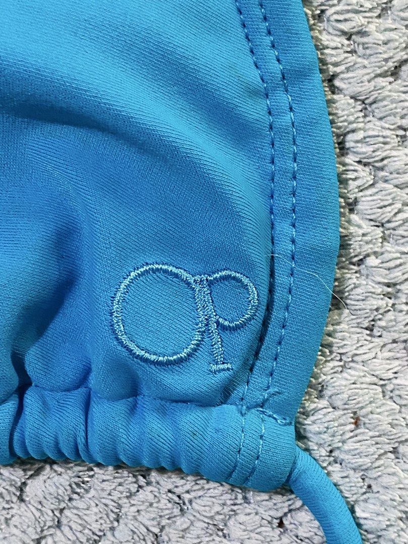 Ocean Pacific Blue String Bikini Top (Category: Bikinis & Swimsuits) located in Bacolod City. Submitted by bravefire_3fe6dd (Listing ID 1460745547, Image 3). Description: - Blue triangle bikini top - Ties at neck and back for adjustable fit - Ocean Pacific logo embroidered on right cup - Perfect for beach or pool days.