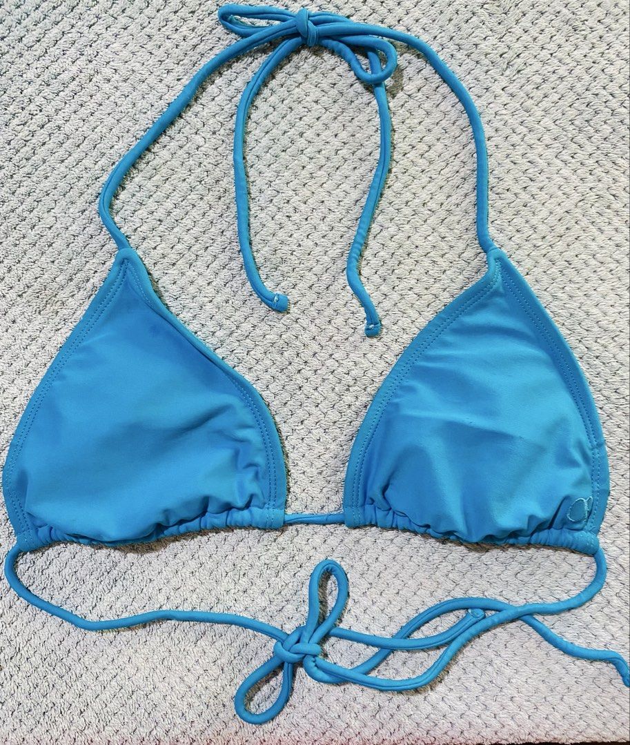 Ocean Pacific Blue String Bikini Top (Category: Bikinis & Swimsuits) located in Bacolod City. Submitted by bravefire_3fe6dd (Listing ID 1460745547, Image 1). Description: - Blue triangle bikini top - Ties at neck and back for adjustable fit - Ocean Pacific logo embroidered on right cup - Perfect for beach or pool days.